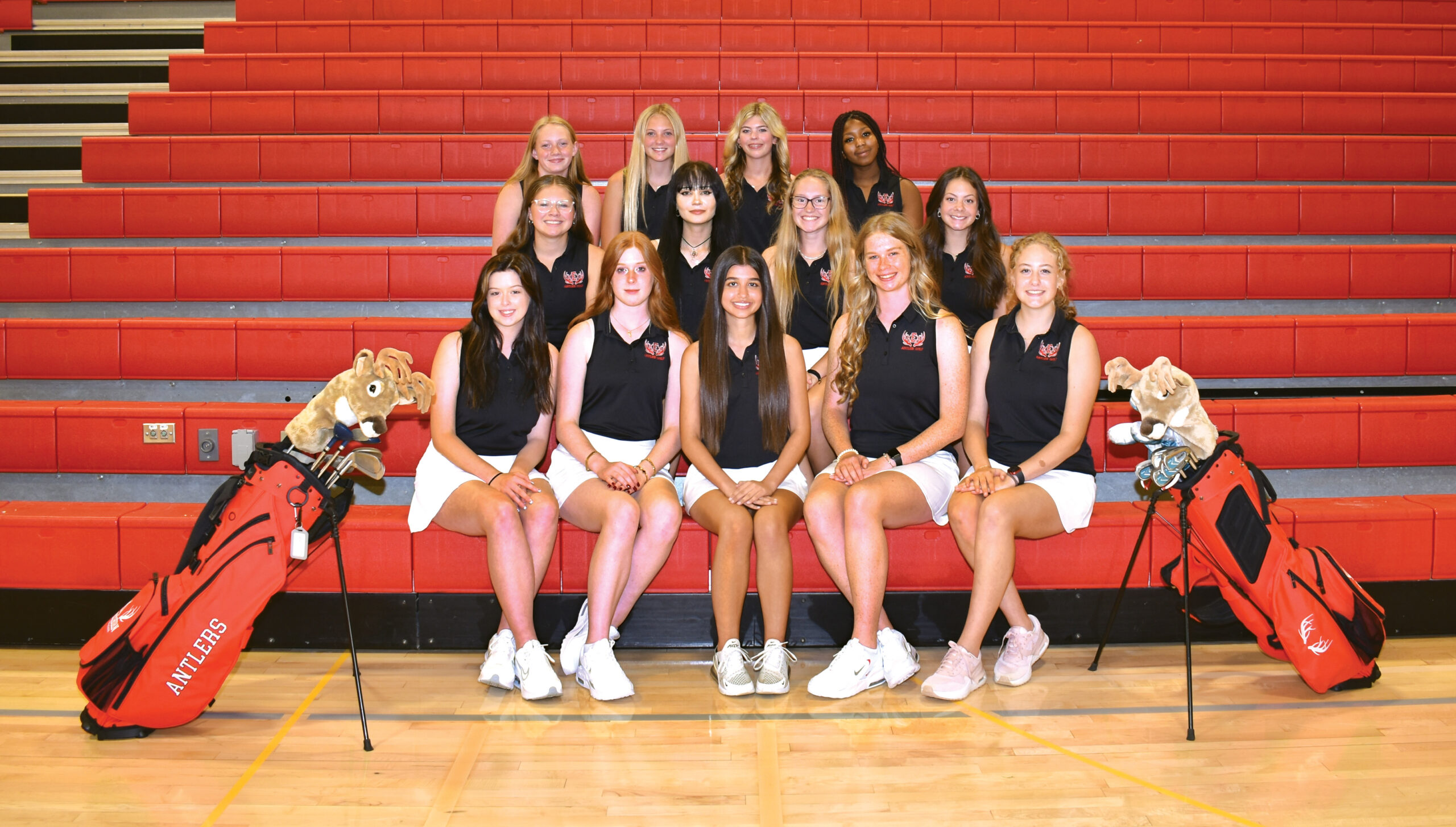 Photo of all girls golf team members