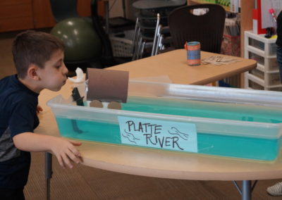 This students acts as the wind as he sets off his wagon!