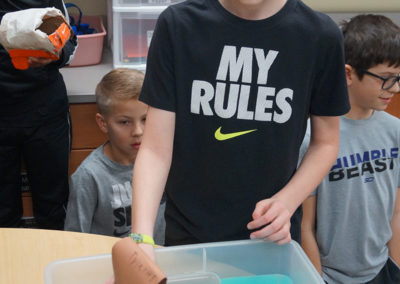 A student sets his egg cargo afloat