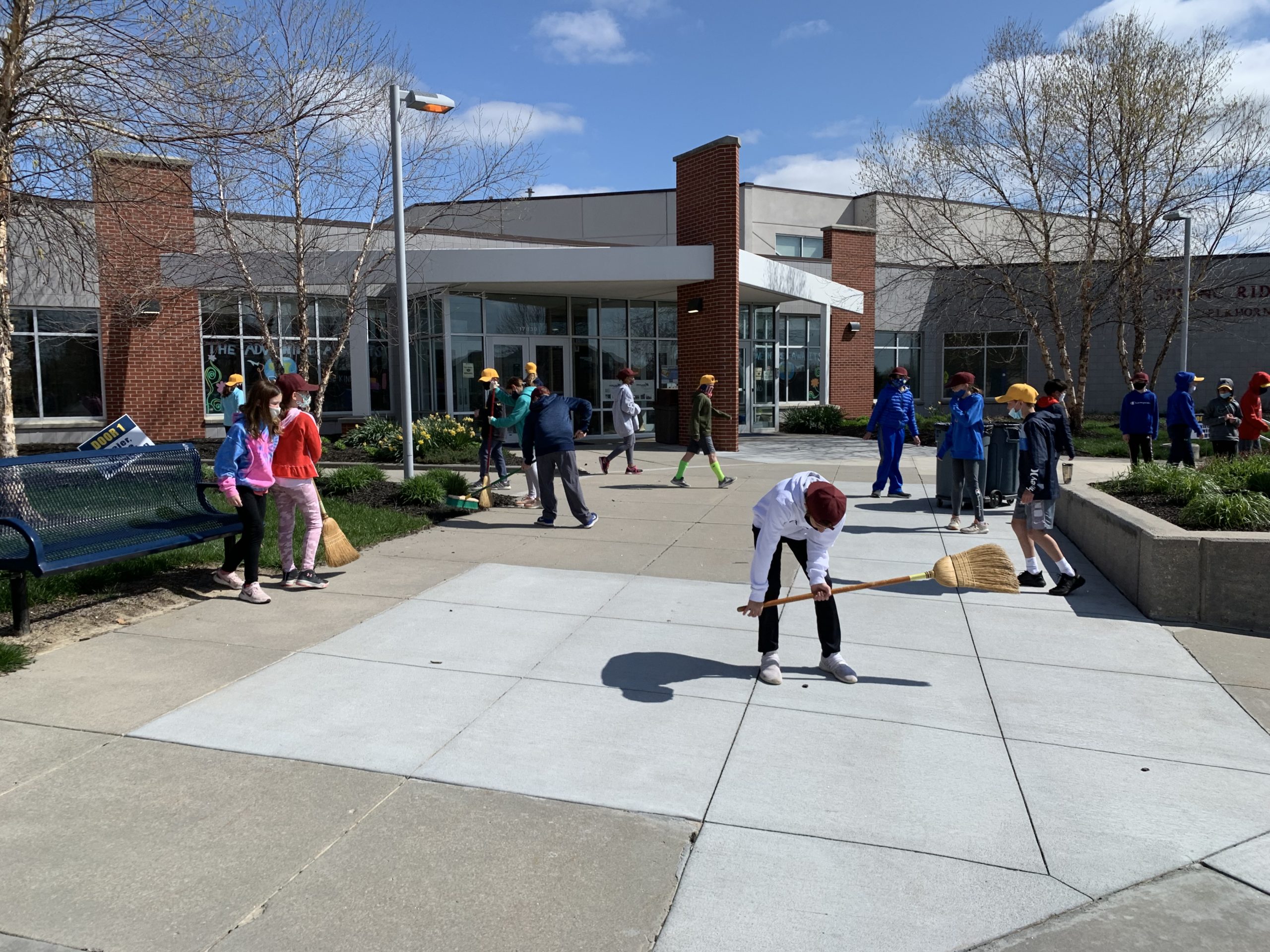 Students cleaning up school grounds