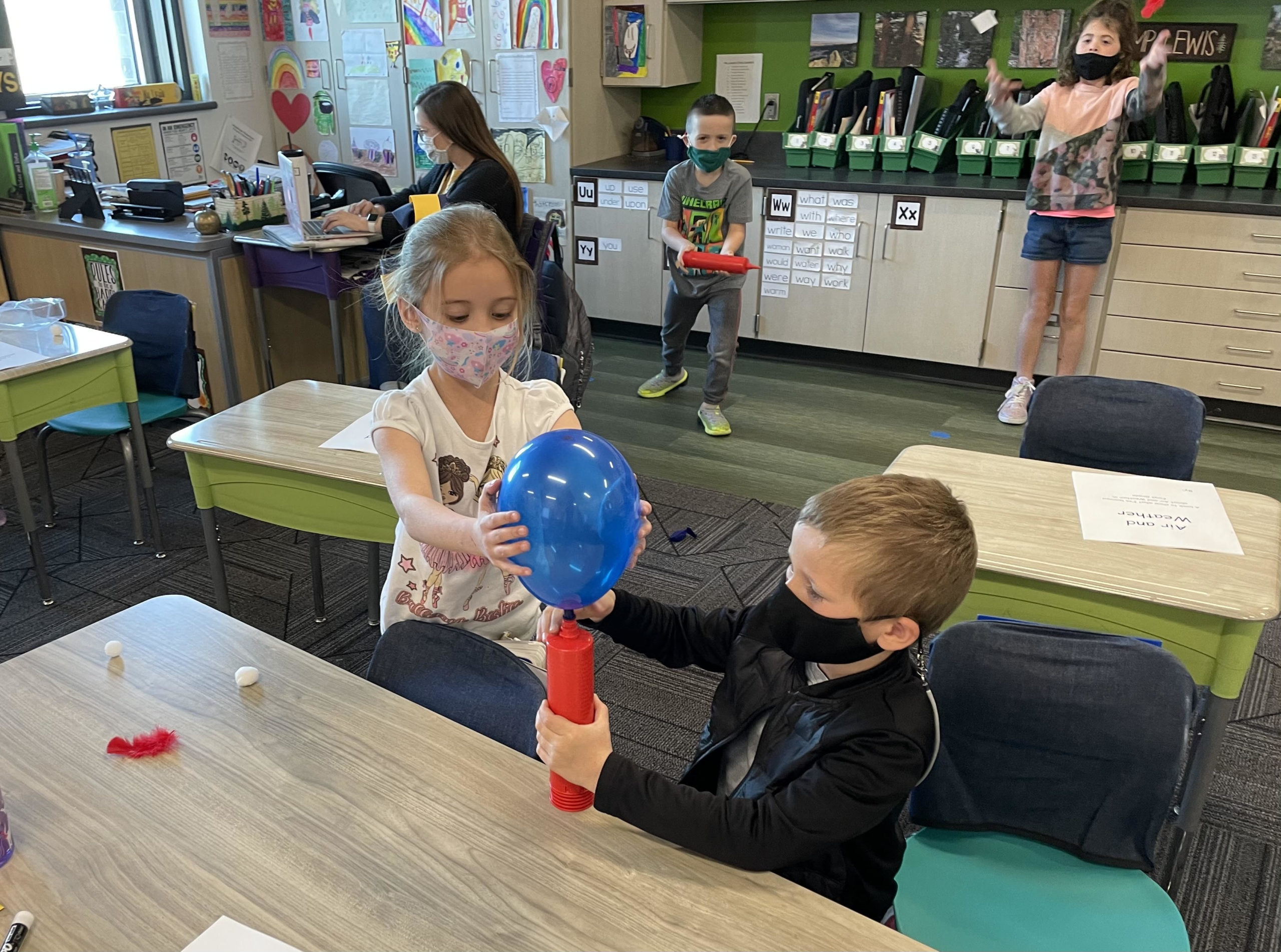 Students Blowing Up Balloon